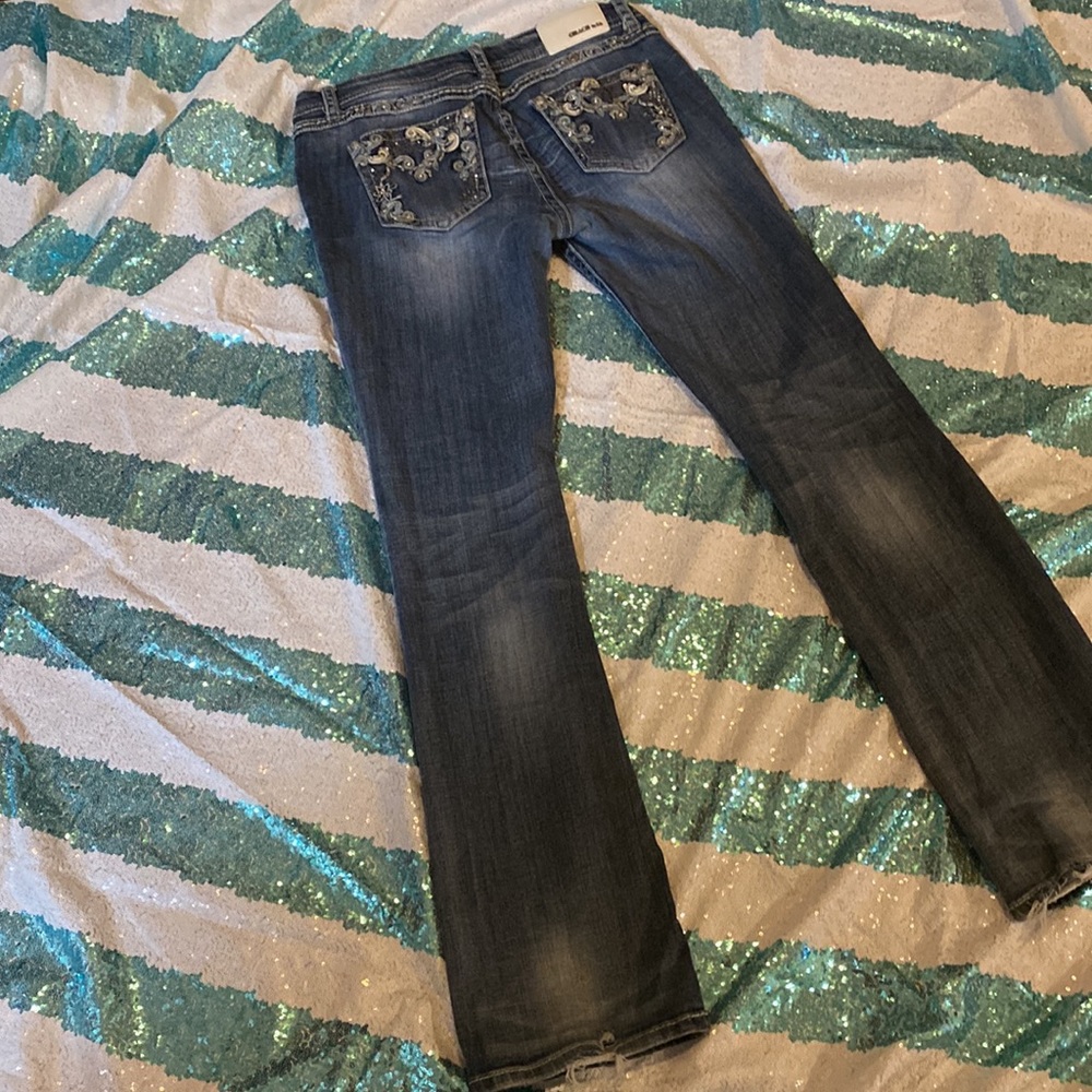 LA GRACE size 30 bootcut light wear on the bottom cuffs shown.